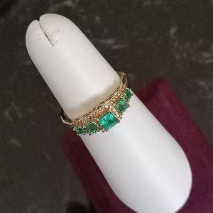 Emerald ring with 14 karat yellow gold 5/8 K of Emeralds and 1/6 K of Diamonds.